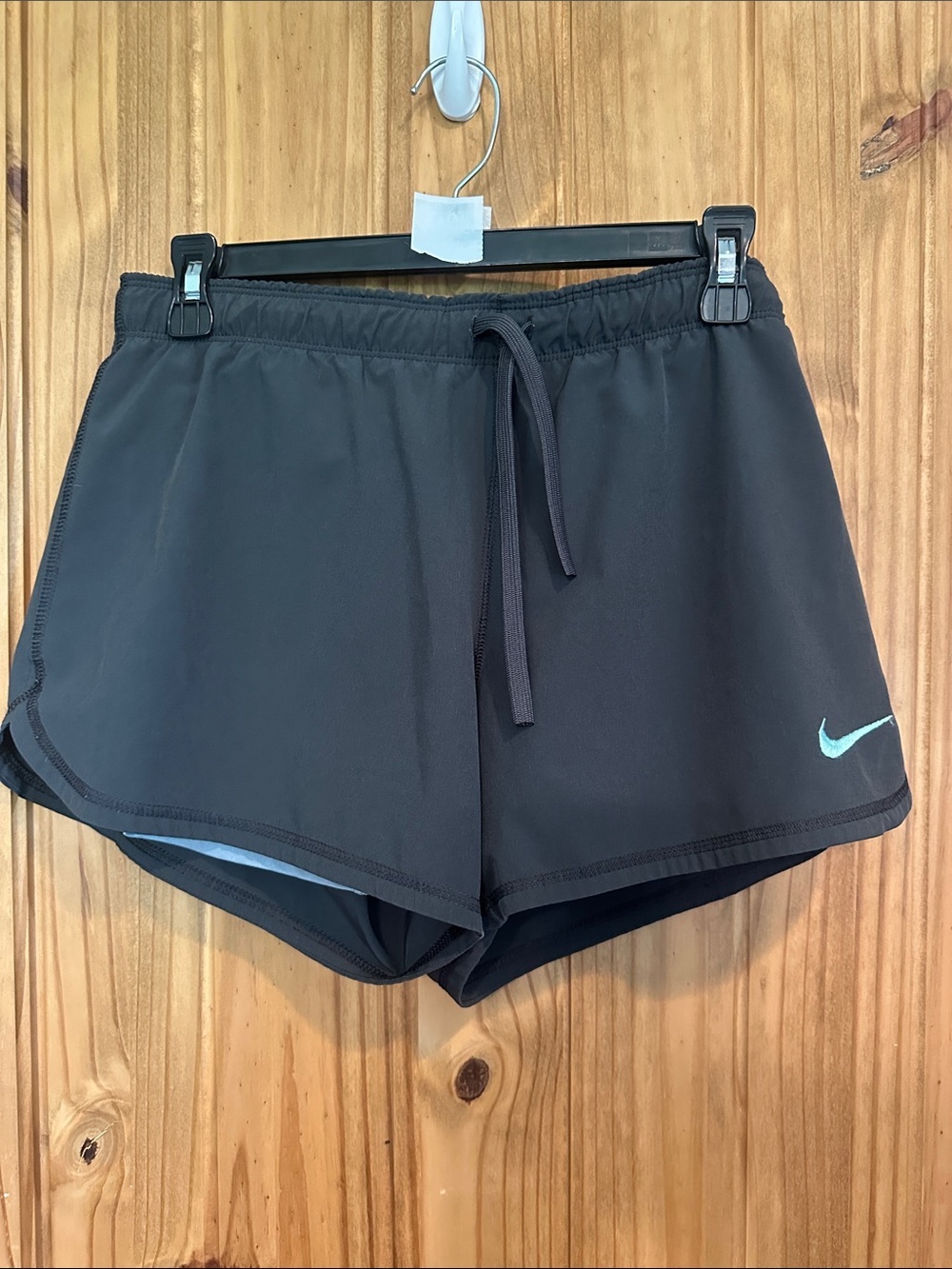 Nike Women's Black Athletic Shorts with Light Blue Swoosh